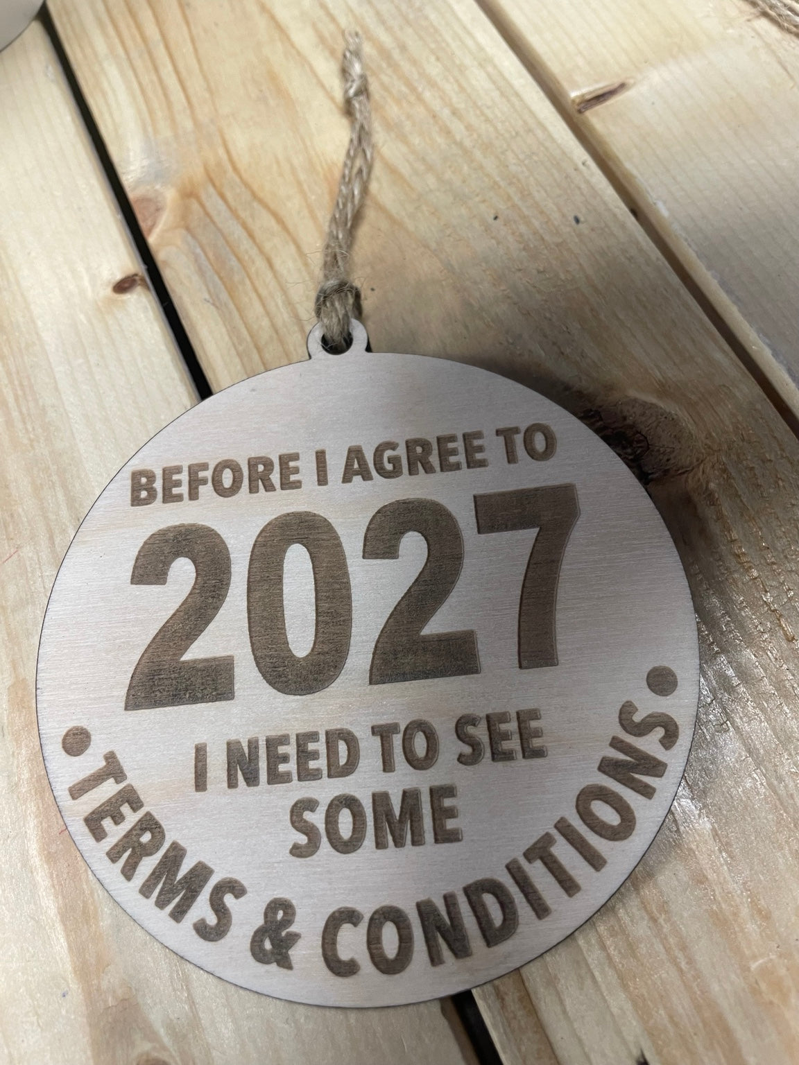 4-inch wooden 2027 Terms & Conditions ornament